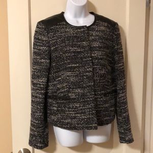 Black and gray button up jacket.